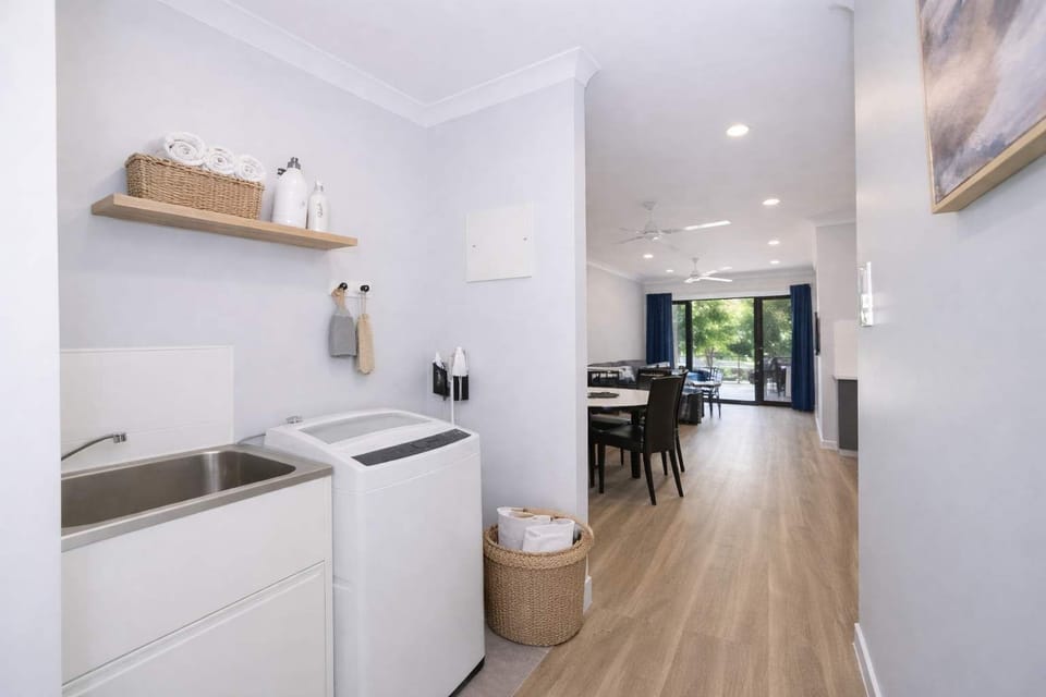 Internal Laundry Area with Washing Machine – Rosslea Townsville Accommodation