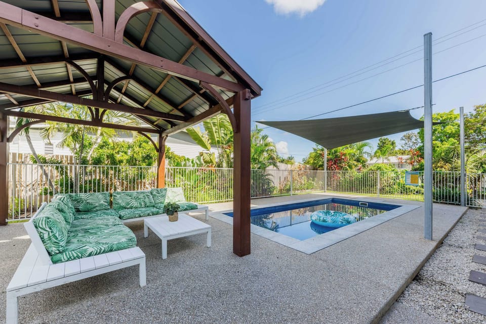 Sparkling private swimming pool with shaded lounge area