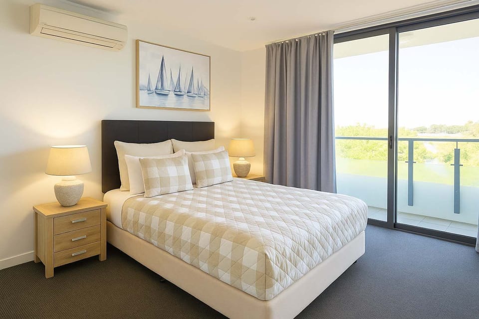Comfortable master bedroom complete with a queen bed and balcony access