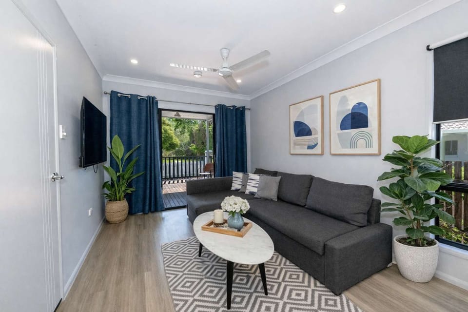 Modern Living Room with Balcony Access – Rosslea Townsville Holiday Accommodation