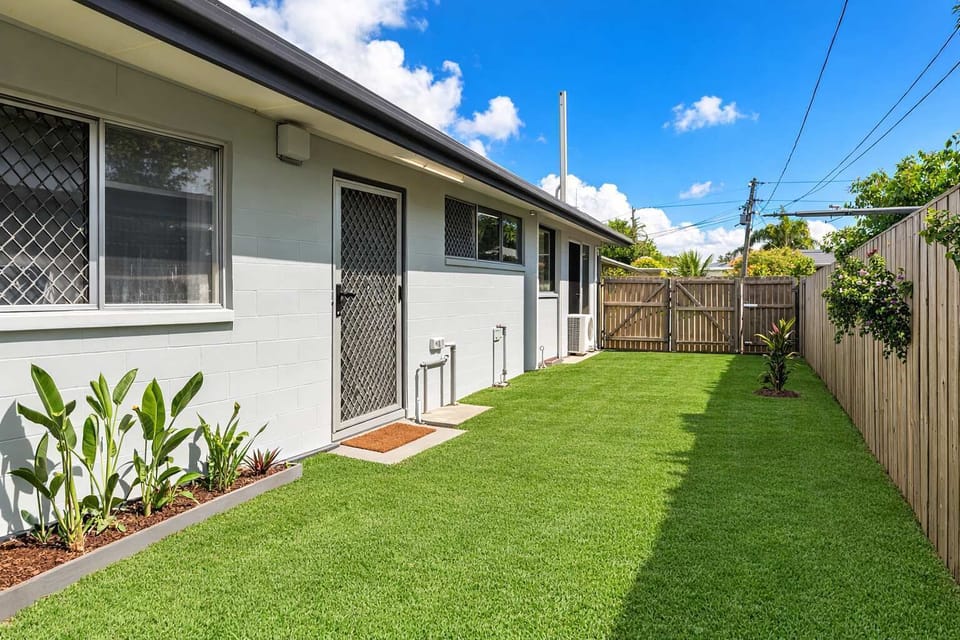Bright Outdoor Lawn Area with Private Fencing