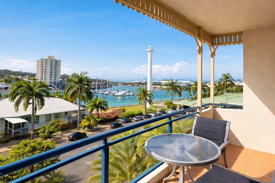 Balcony View Overlooking Marina and Palm Trees