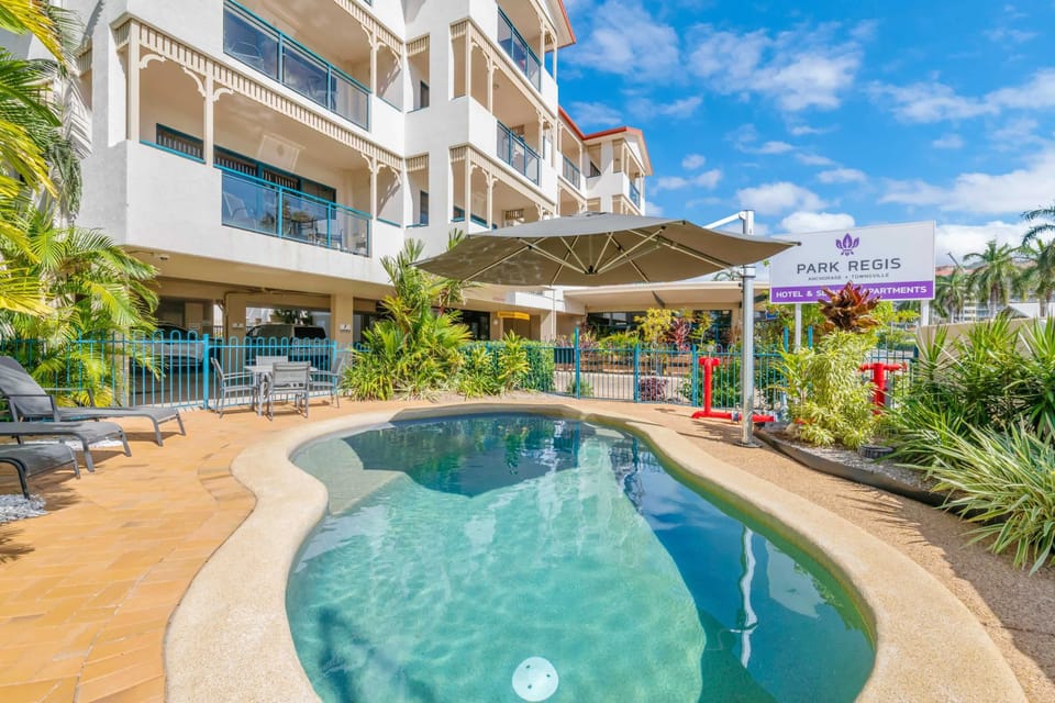 Resort Swimming Pool with Sun Lounges and Tropical Gardens, Townsville