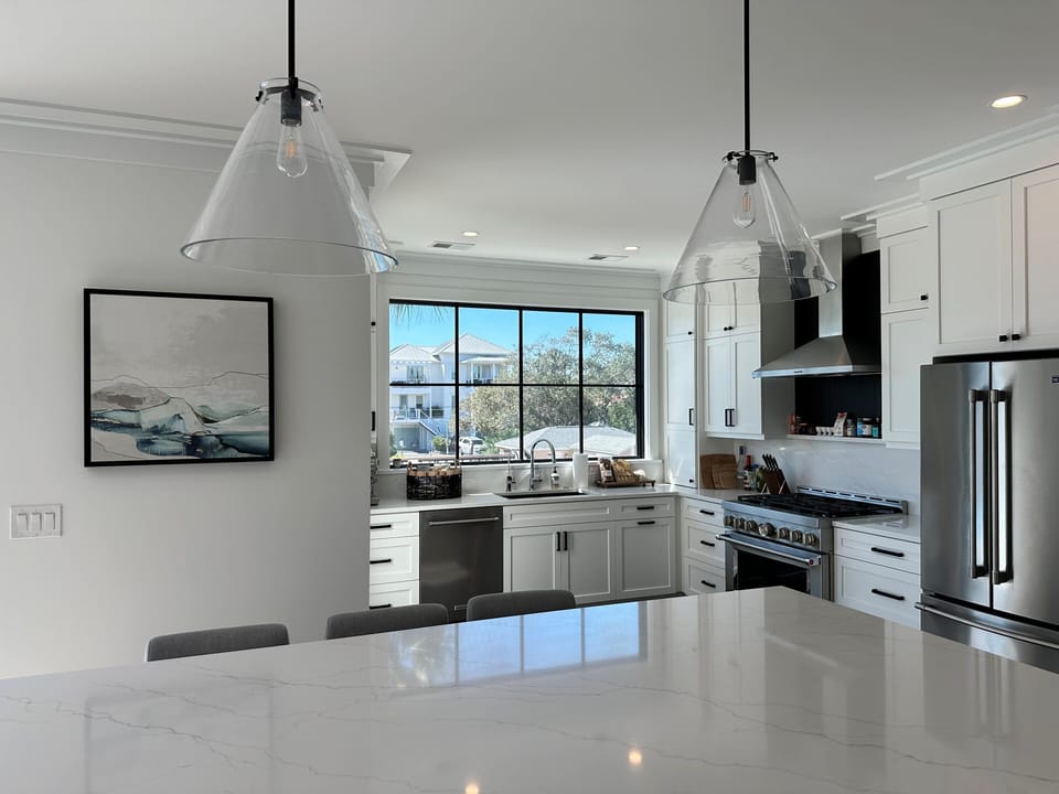 Huge oversized and stunning quartz island provides optimal space for entertaining and dining in this ultimate high-end kitchen