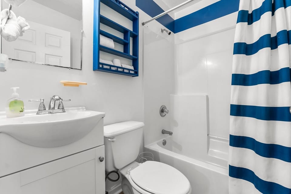 Spacious 2nd floor bathroom offering a relaxing tub and shower combination.