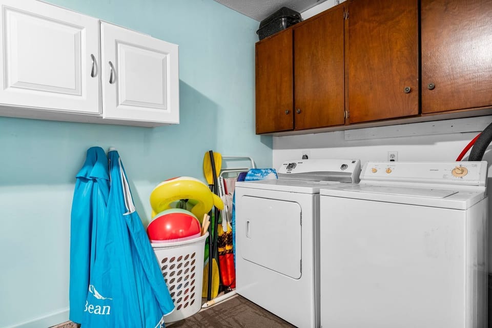 Functional laundry space in the garage, perfect for quick and easy care.