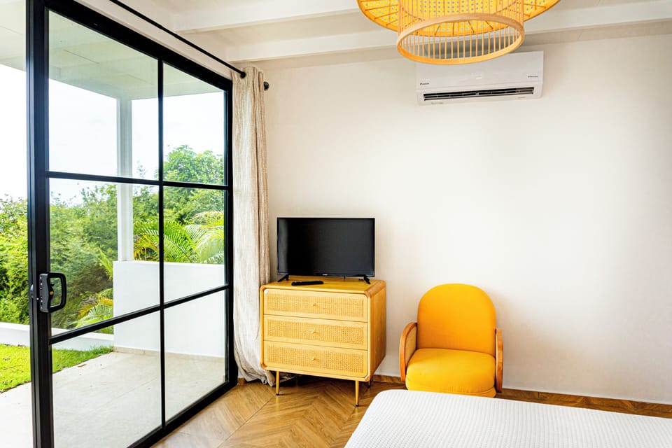 Spacious primary suite with ocean views and ensuite bath