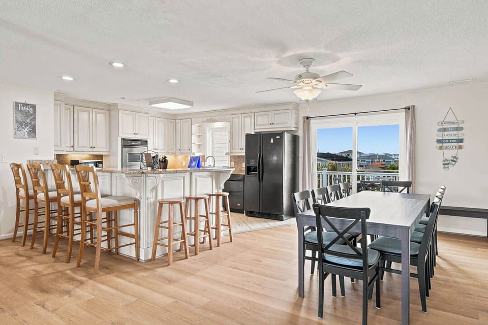 Top-Level Dining Table (seats 10) and Kitchen with Bar (seats 7)