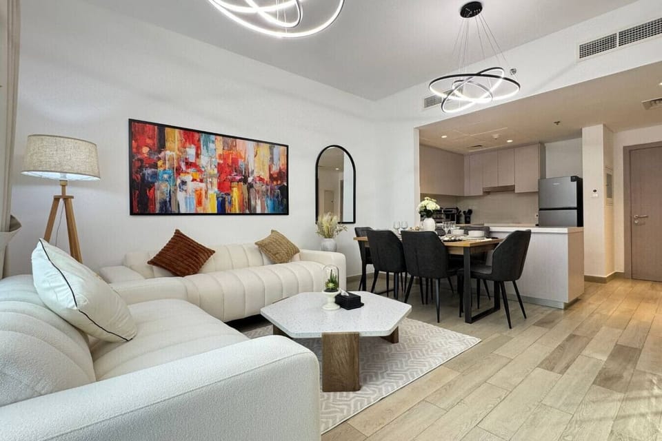Contemporary living and dining area with open-plan layout and modern furnishings.