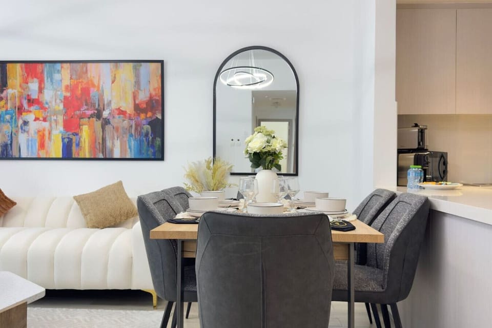 Stylish dining room featuring circular furniture and clean interior design.