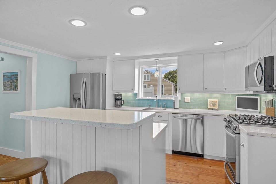 Kitchen with dishwasher and refrigerator with ice maker and filtered water