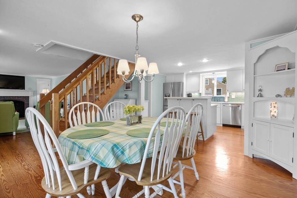 Dining table and views of the kitchen and living room
