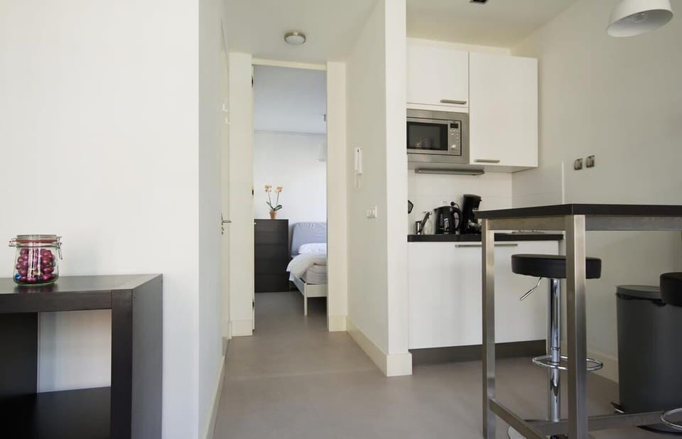 View from hallway into living and kitchen