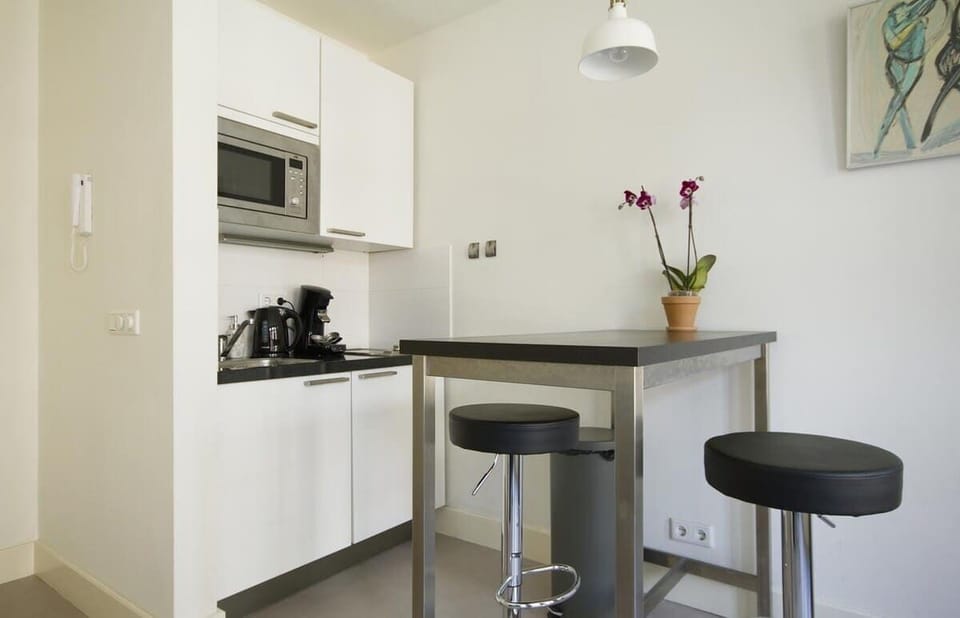 Compact kitchen with sleek bar setup