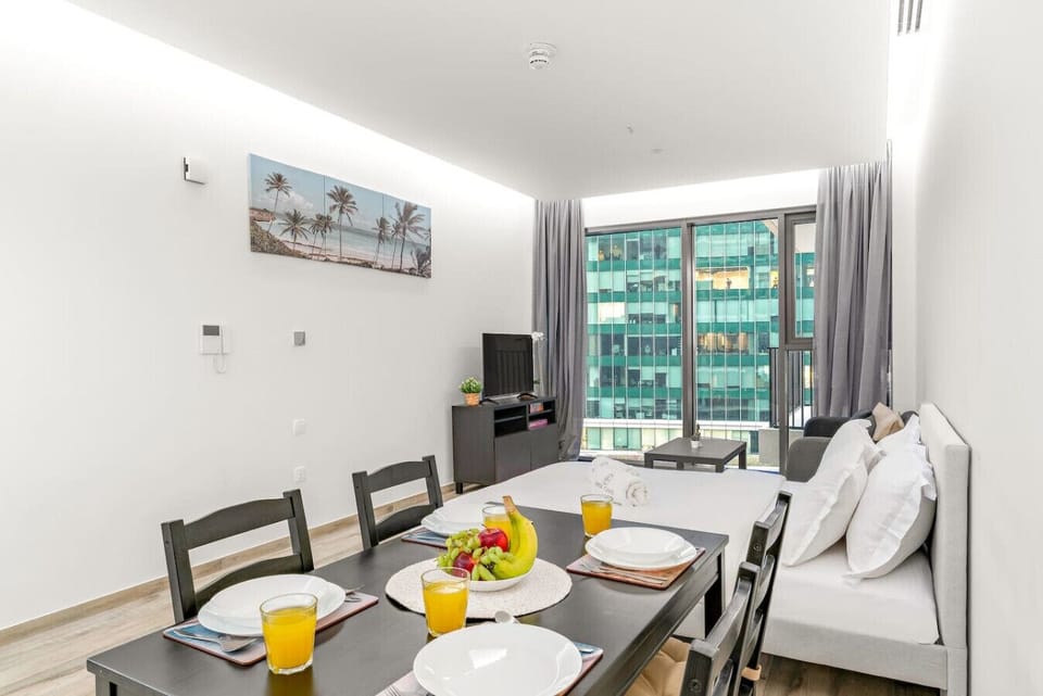 Dining & Living Area: Stylish space with city views, perfect for dining and relaxing with friends!