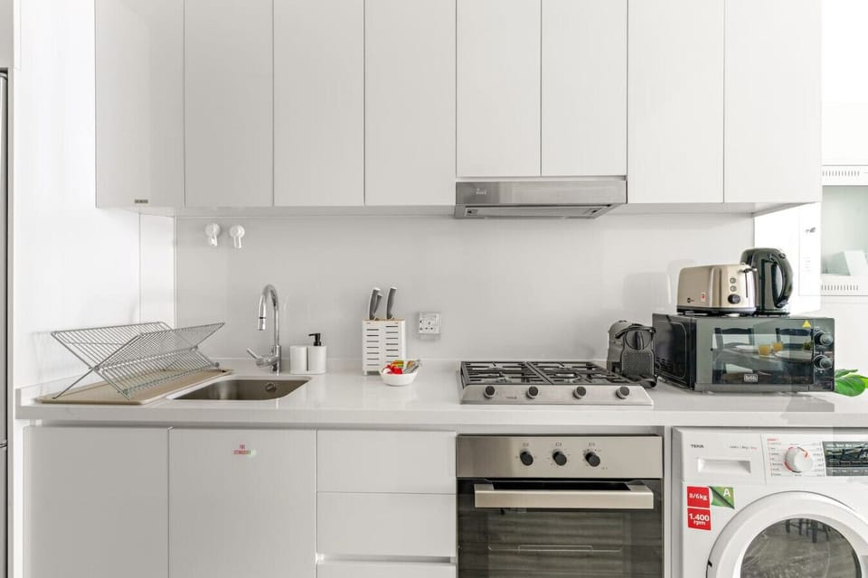 Kitchen: Sleek modern design with top-notch appliances for your culinary adventures!