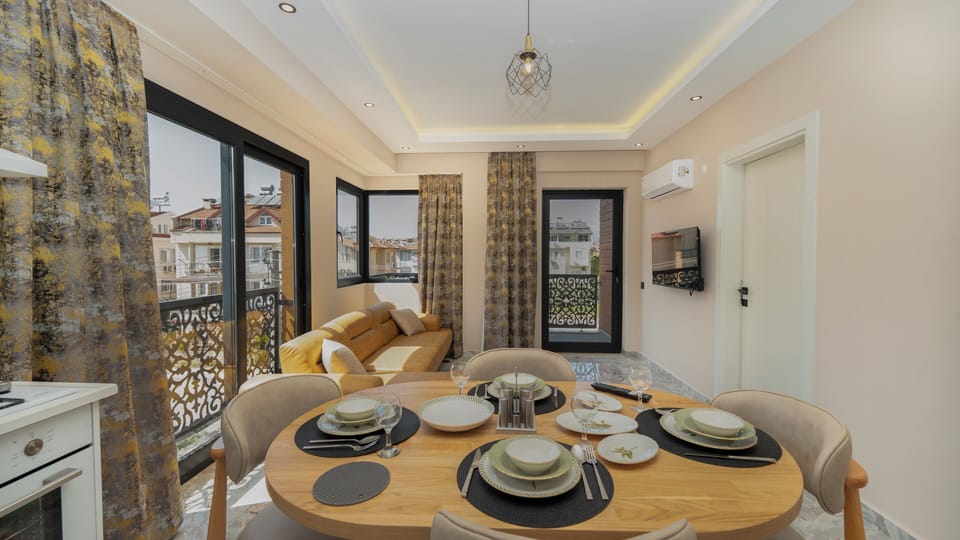 Comfort Apartment, City View | Living area | 127-cm Smart TV with satellite channels