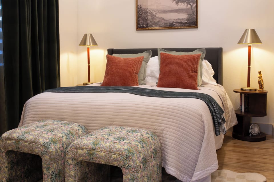 A plush bed with warm tones for a restful retreat.