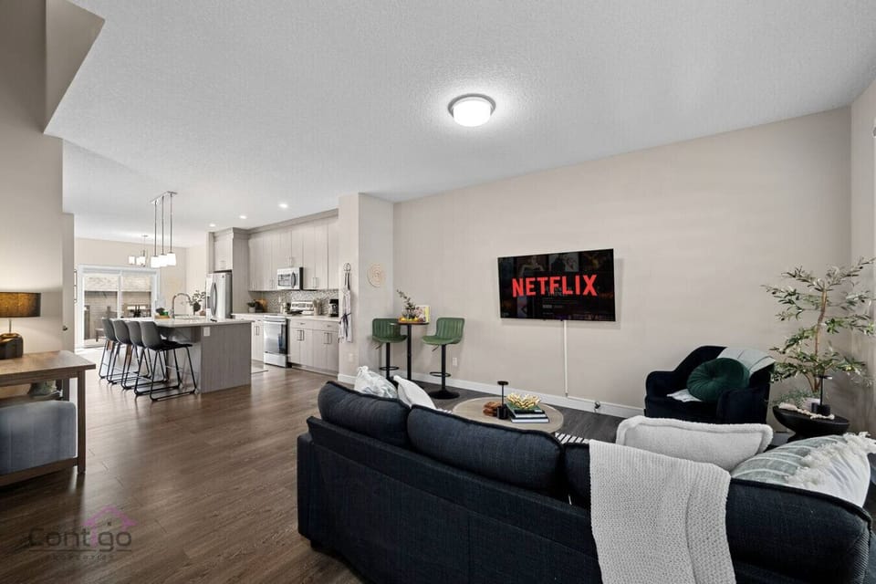 Comfortable seating awaits you! Relax and connect in the open living space, complete with a smart TV for seamless entertainment and quality time together.