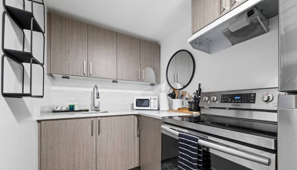 Kitchen goals! Whip up your favorite meals with our handy stove, microwave oven, and full set of utensils. Easy peasy