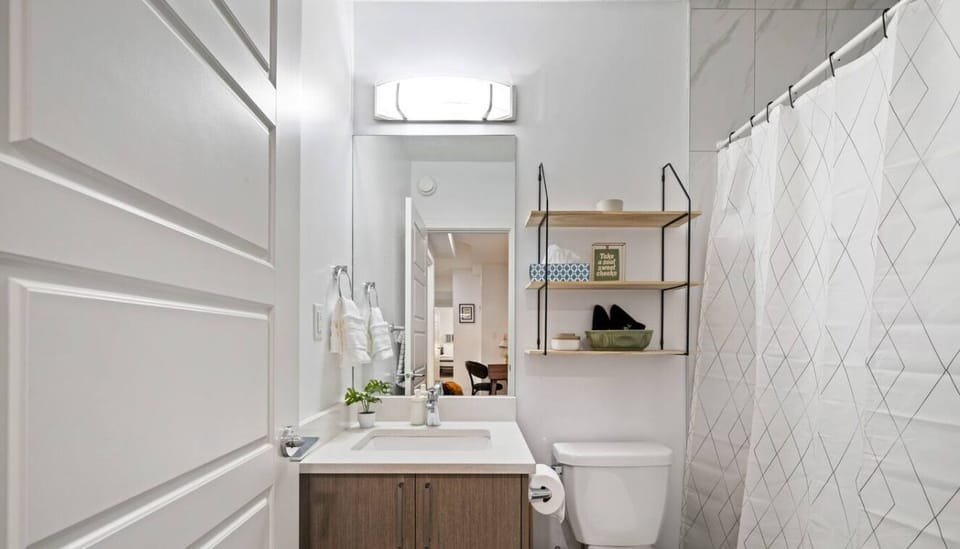 Your daily glow-up spot! Fully stocked with toiletries (yes, even conditioner!) and a great mirror.
