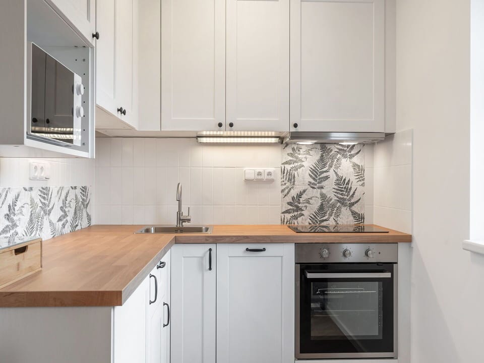 Kitchen, Countertop, Kitchen Appliance, Cabinetry, Flooring, Major Appliance, Interior Design, Wood, Sink, Plumbing Fixture