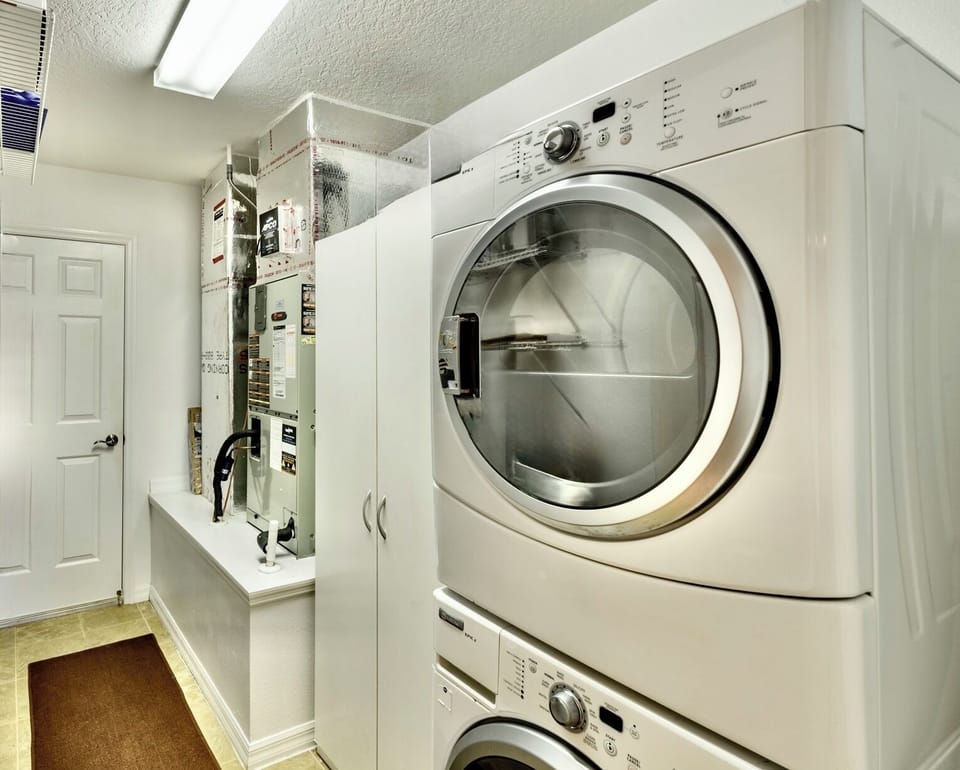 Utility Room with Washer/Dryer and the Entrance to the Garage. See Garage Availability in the Listing Description