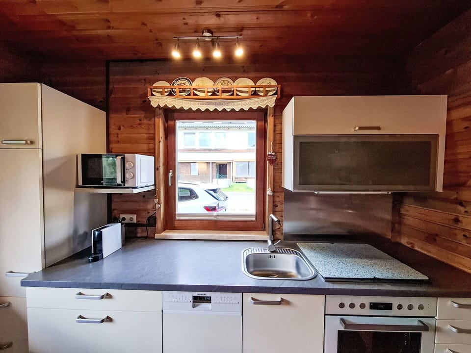 Wood, Kitchen, Kitchen Appliance, Countertop, Interior Design, Major Appliance, Wood Stain, Room, Cabinetry, Hardwood