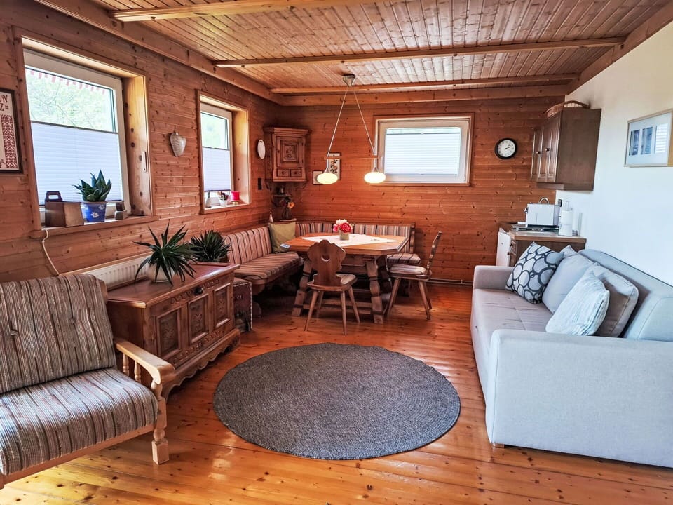 Furniture, Wood, Flooring, Couch, Interior Design, Floor, Living Room, Room, Table, Home