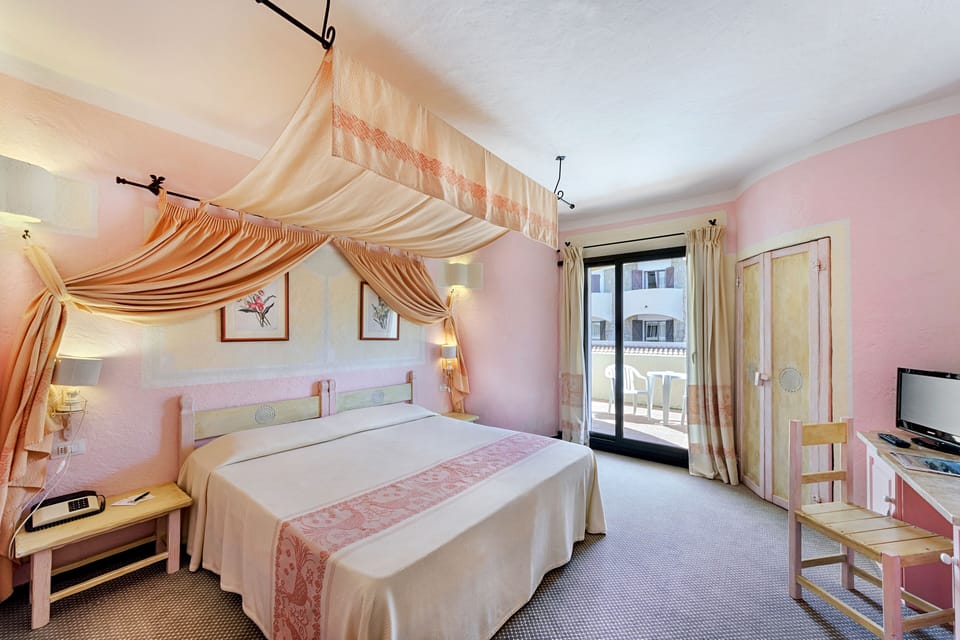 Standard Double Room, Partial Sea View | Minibar, in-room safe, desk, free WiFi
