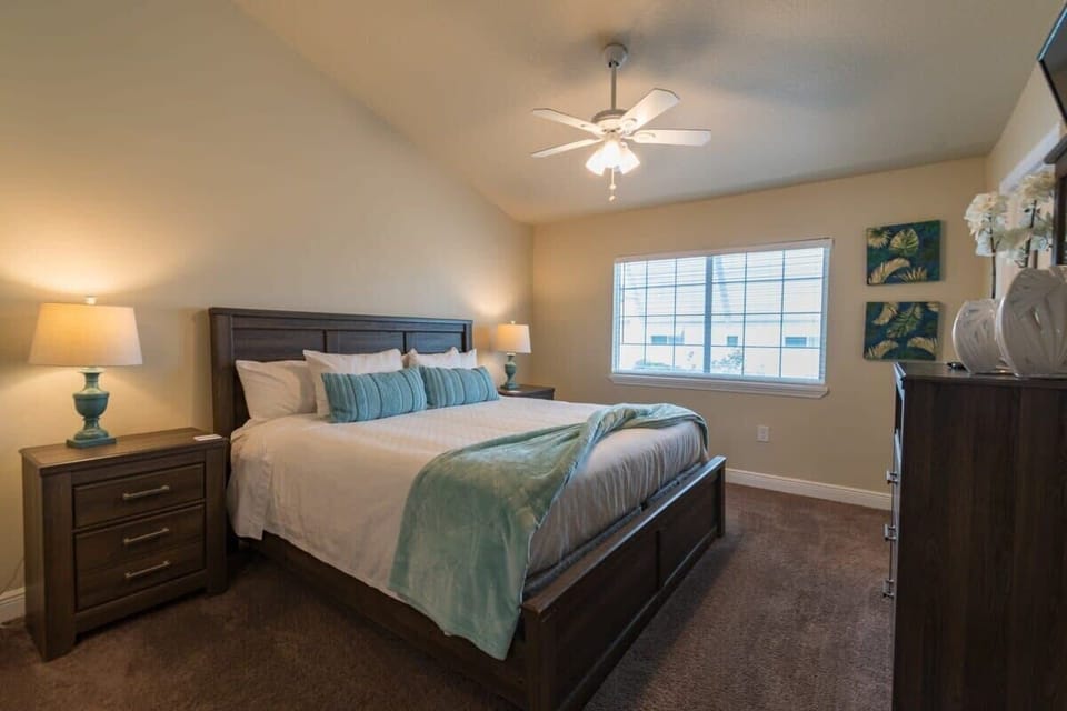 Cozy bedroom with a large window and wooden furniture