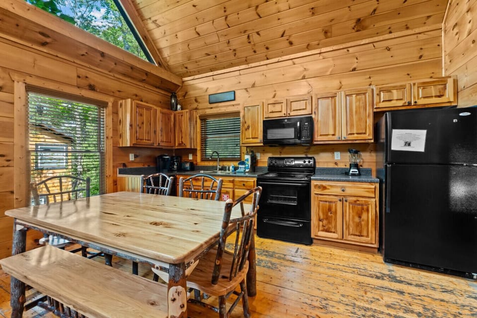 This fully equipped rustic kitchen has everything you need to cook up a hearty mountain breakfast—or a late-night snack after soaking in the hot tub.