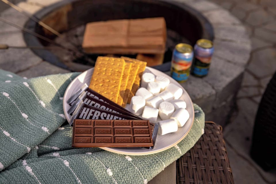 Everything you need for the perfect Montana evening – s’mores, drinks, and a crackling fire under the pines.