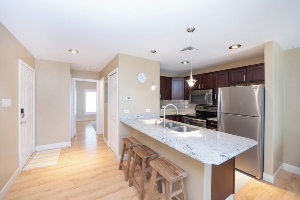 Kitchen with island and bar seating.