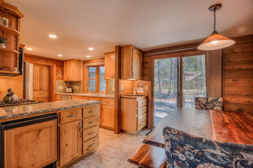 Dining Area, looking into kitchen with access to back deck