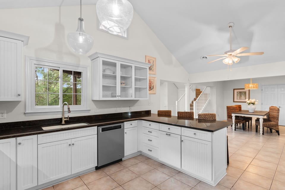 Your bright kitchen opens to dining area, perfect for cooking together and gathering around meals.