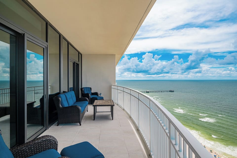 Relax while taking in breathtaking views of the water and vibrant skies from your balcony
