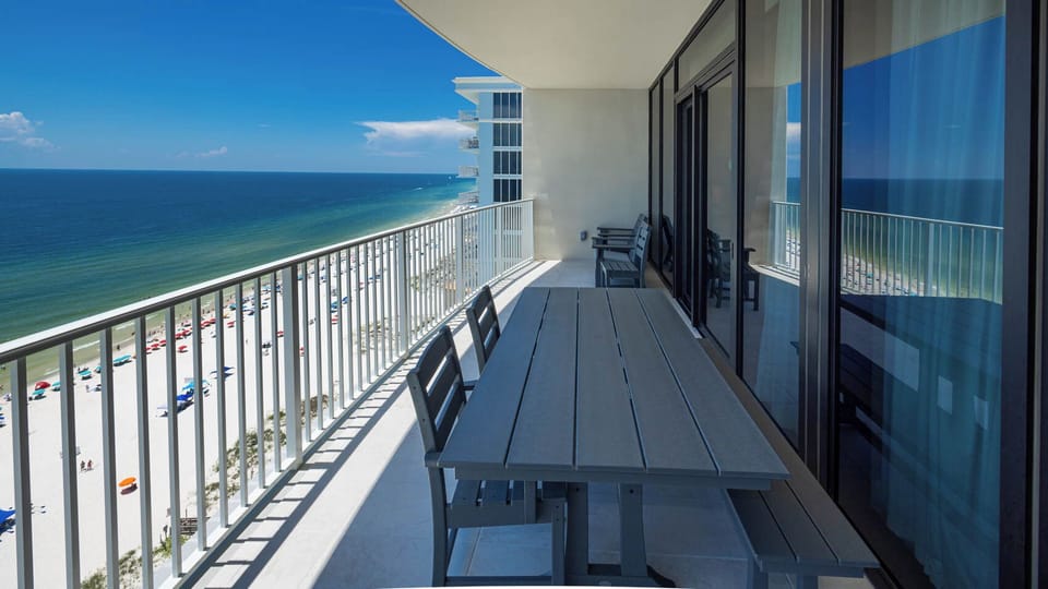 Relax on your beachfront balcony while taking in the seemingly endless coastline views