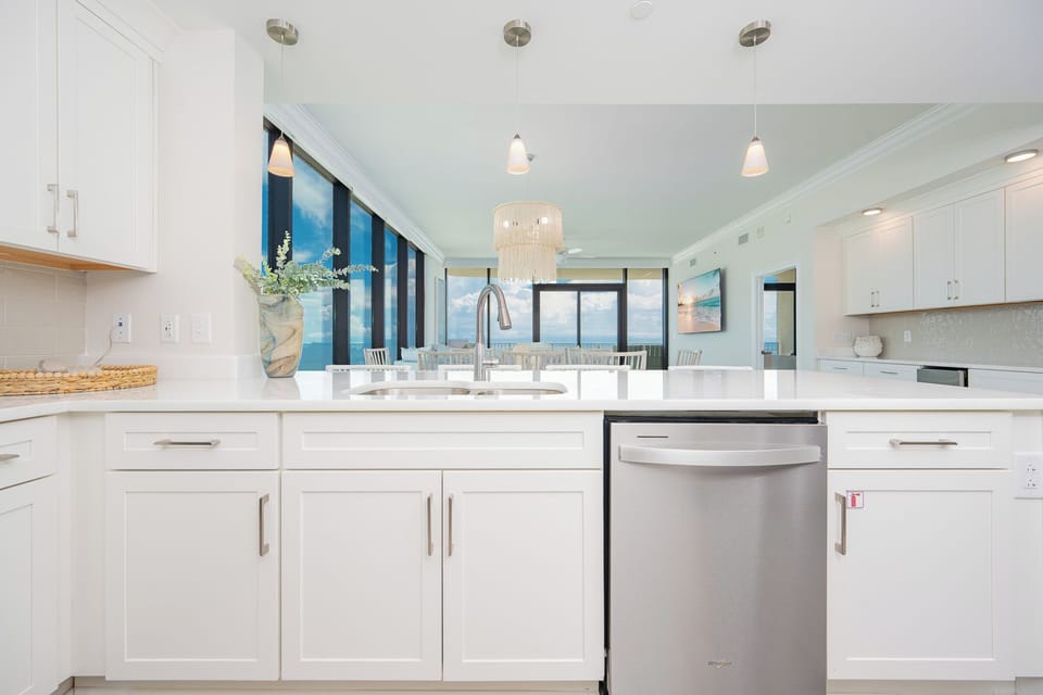 Cook and gather in this elegant kitchen with stunning views of the beach