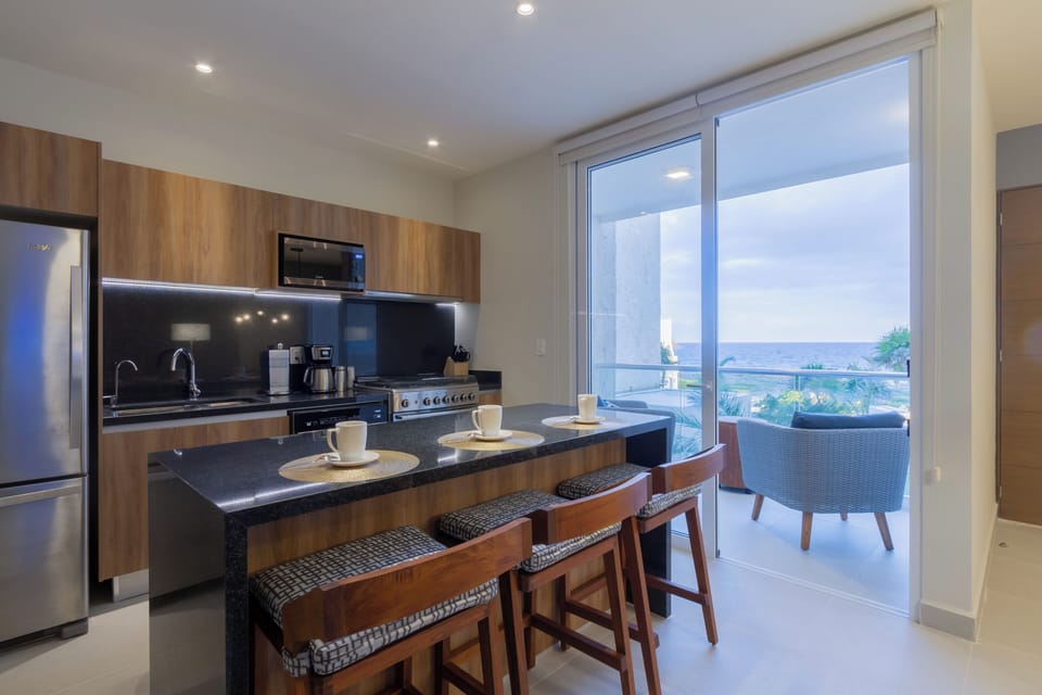 Condo, Beach View | Private kitchen | Coffee/tea maker, electric kettle, dining tables