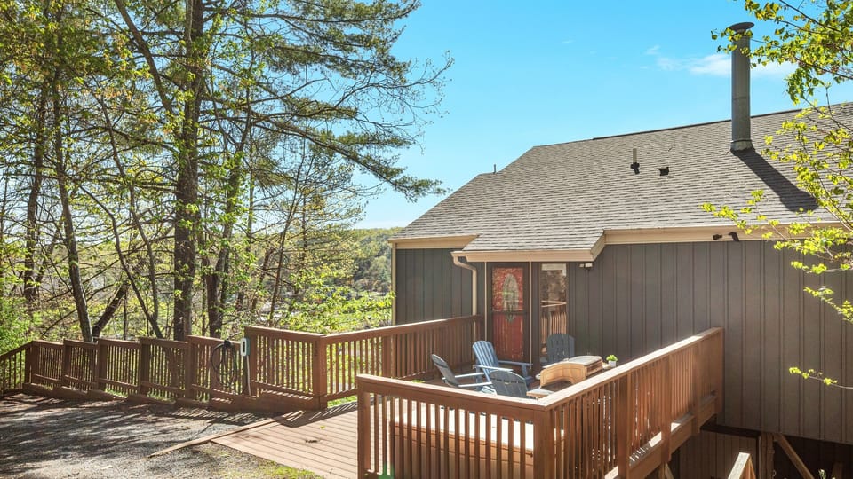 Front entrance with seating, a fire pit and 36 feet of parking