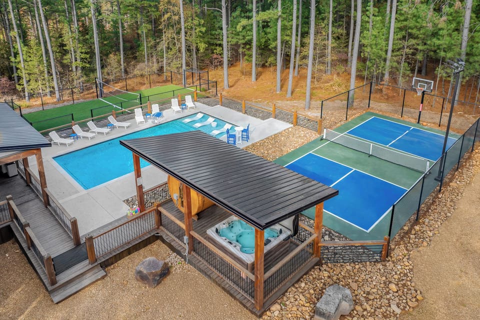 Multiple layers of fun: Pickleball court, hot tub/sauna, pool, and turf court