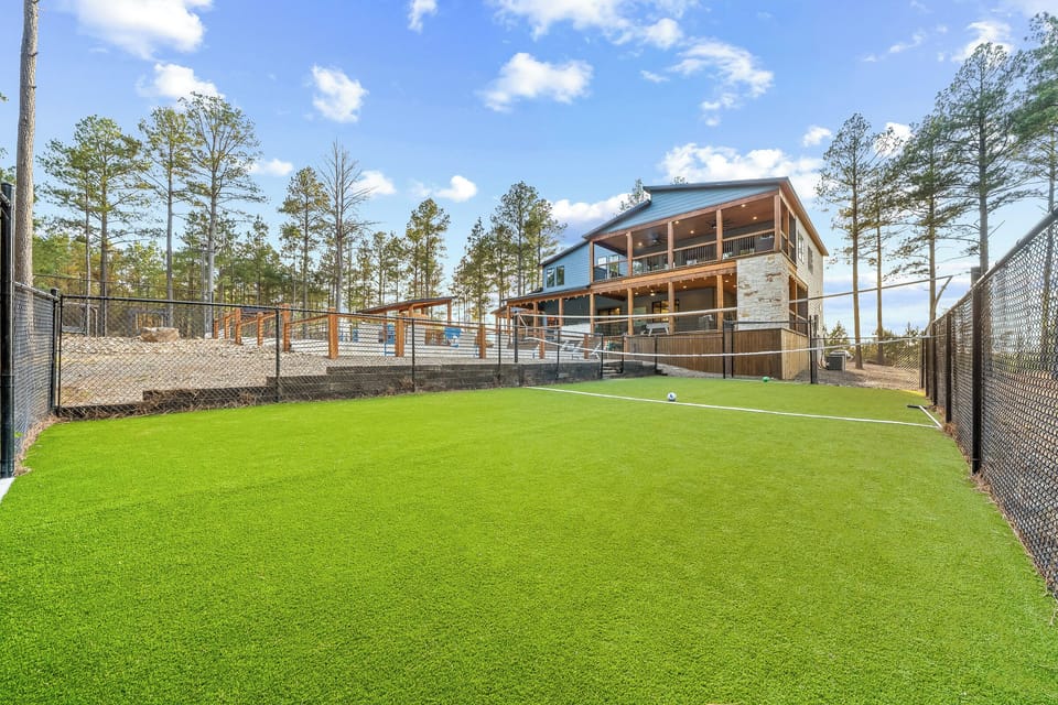 30x60 turf field for multi-purpose use. Each end has built in soccer goals as well + volleyball net available to use