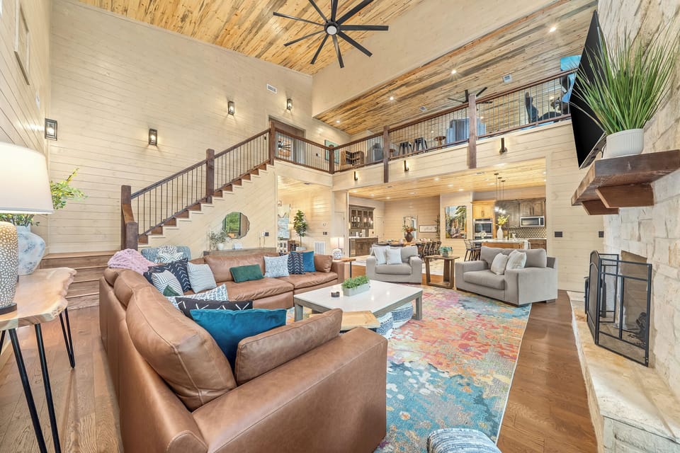 Big family room that leads into the kitchen with lots of seating
