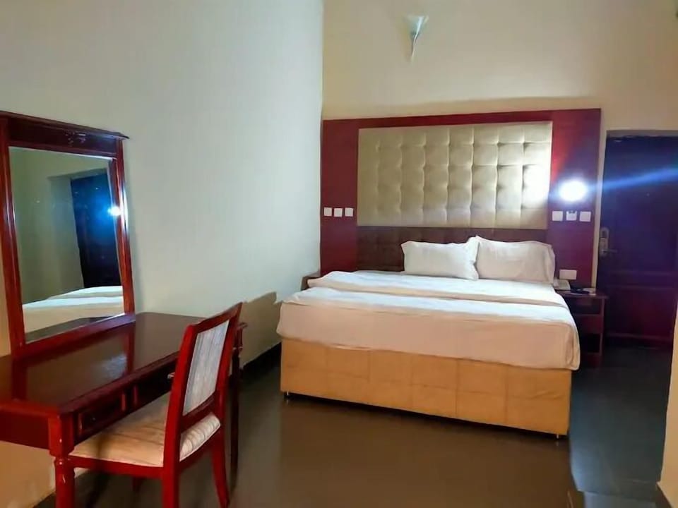 Deluxe Room, Balcony, City View | Desk, laptop workspace, blackout drapes, soundproofing