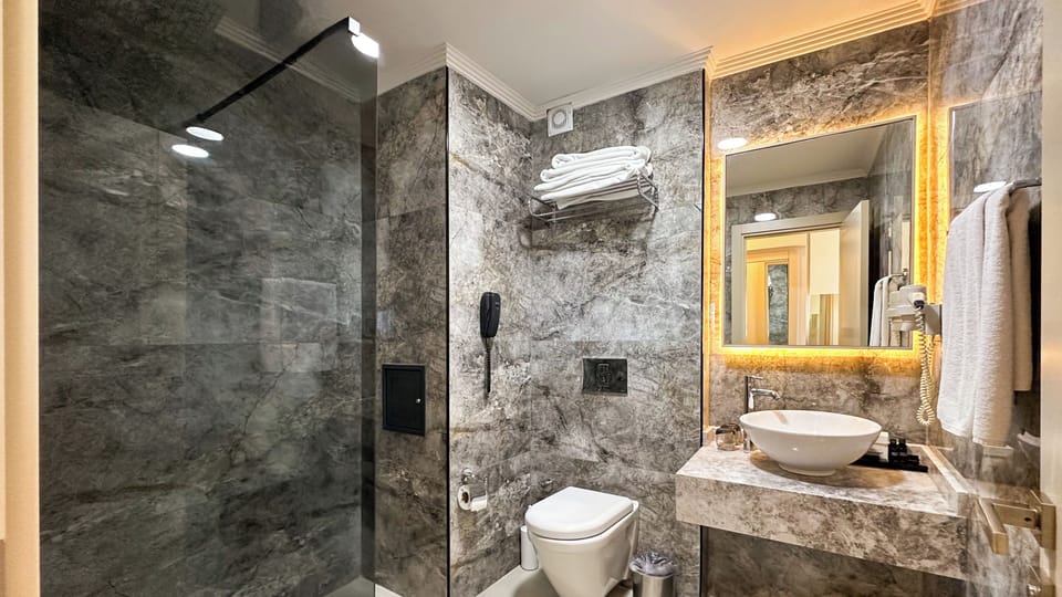 Suite, Non Smoking, Sea View | Bathroom | Shower, hair dryer, towels, soap