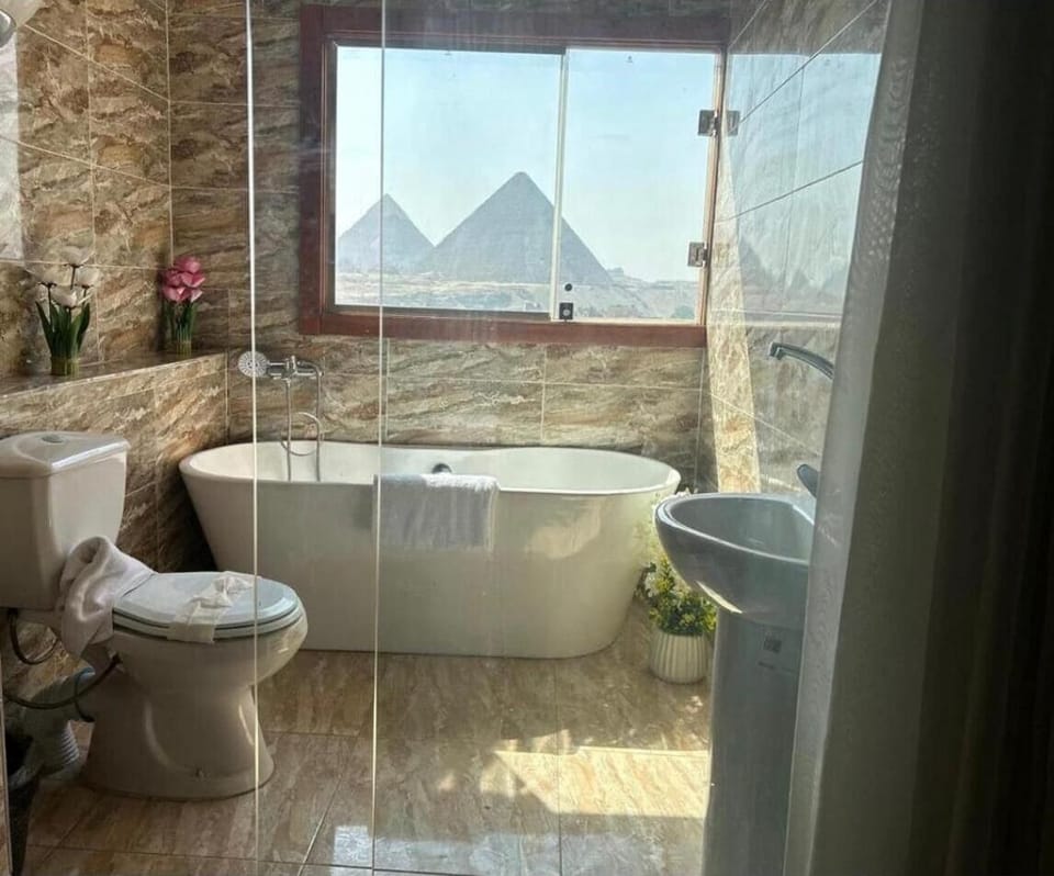 Deluxe Triple Room | Bathroom | Separate tub and shower, rainfall showerhead, hair dryer, slippers