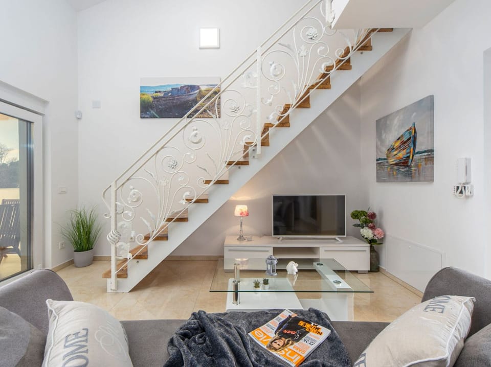 Villa (Three Bedroom House with Pool) | Living room | 32-inch flat-screen TV with satellite channels
