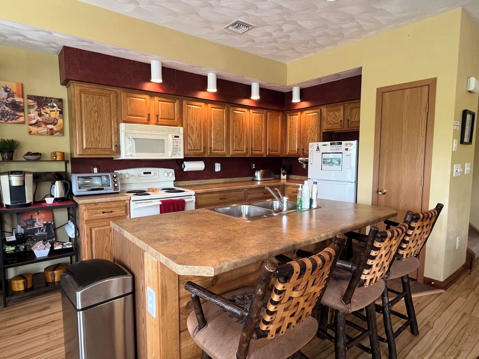 The spacious kitchen is equipped with all of the basic necessities for cooking.