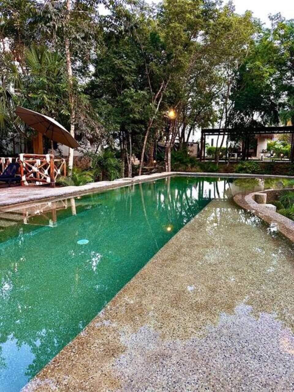 Stunning pool with a natural, tranquil setting.